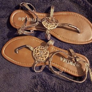 A bronze pair of sandals